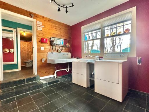 Inside the main entry in the back of the home you will find this spacious laundry/mud room.