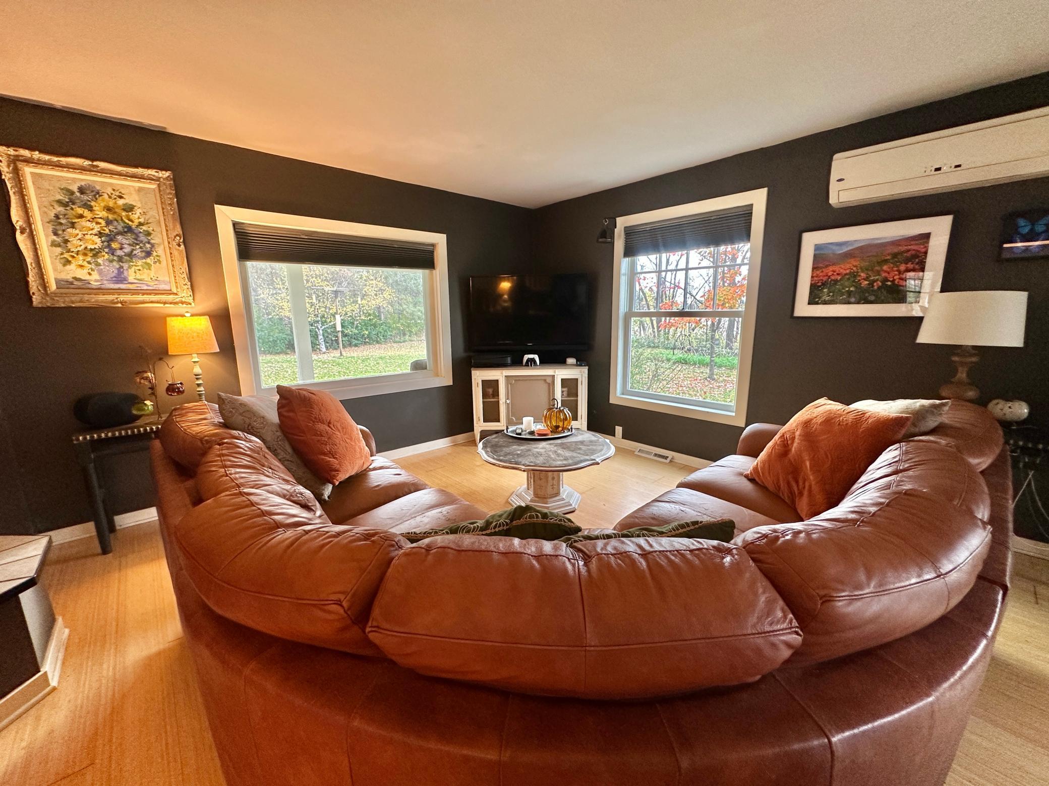And this is where the family time happens. Notice the mini split that keeps this area comfortable no matter the season. This main level also has in floor heat to bring the cozy.