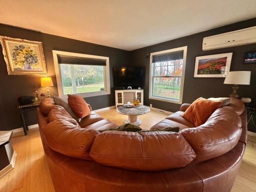 And this is where the family time happens. Notice the mini split that keeps this area comfortable no matter the season. This main level also has in floor heat to bring the cozy.