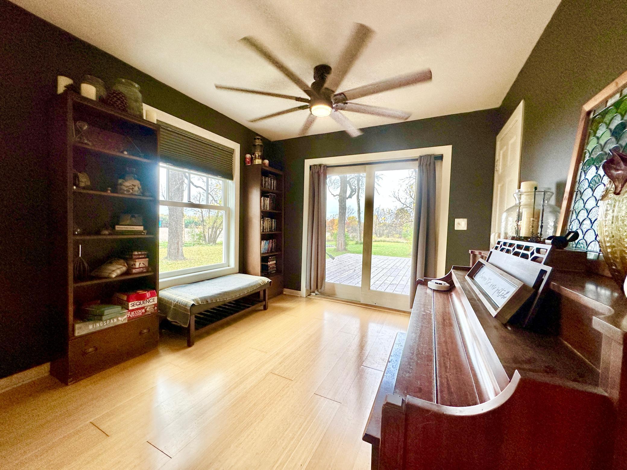 Adjacent to the living room is the piano room that could serve a number of purposes as well as access to the deck.