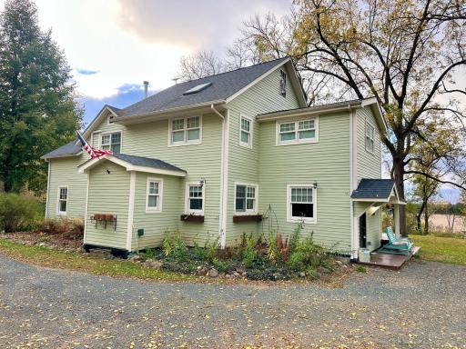 The back of the home enjoys a covered porch as well that serves as the main entry.
