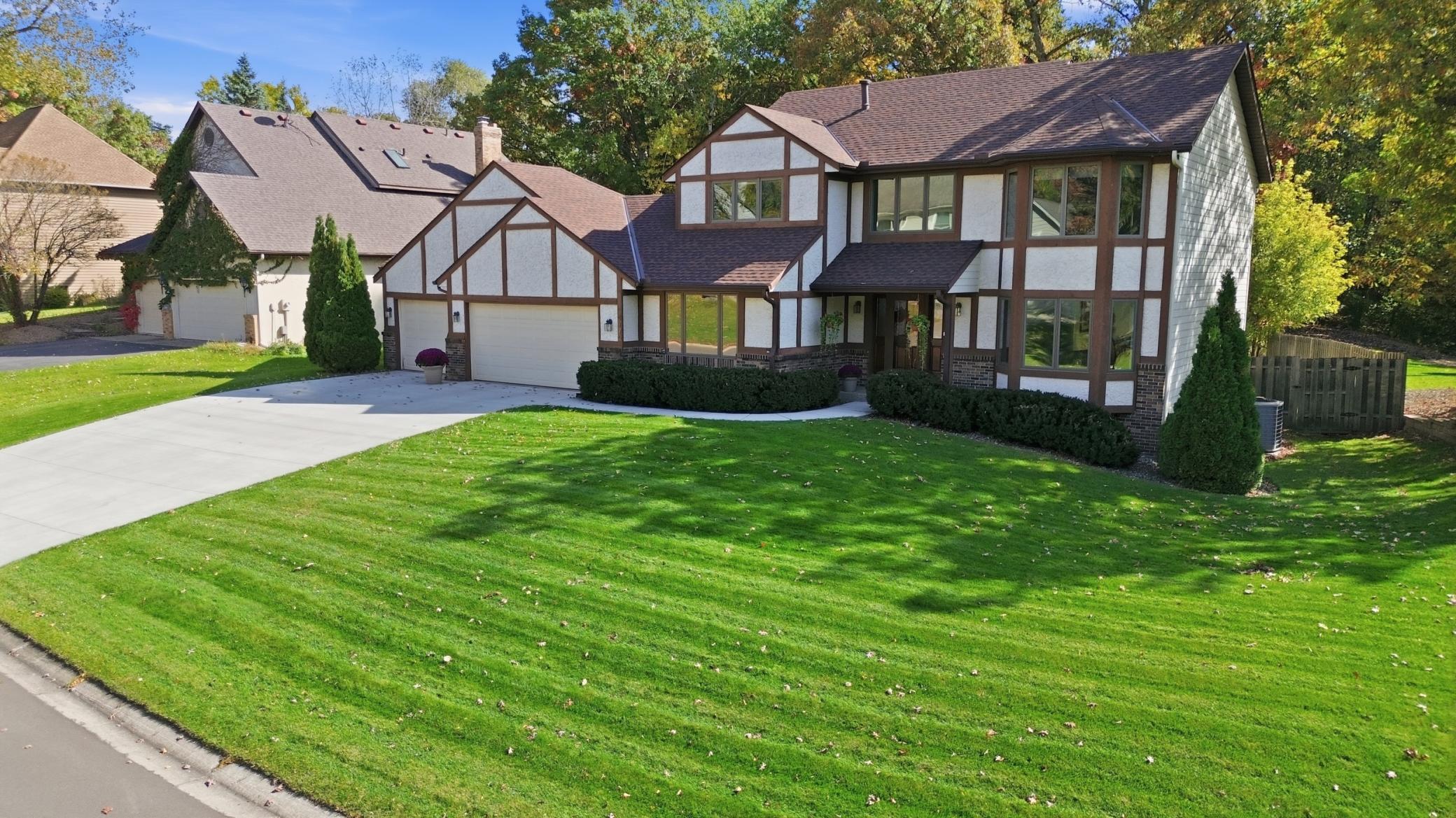Stately Tudor-style two-story in prestigious Brittany Estates.