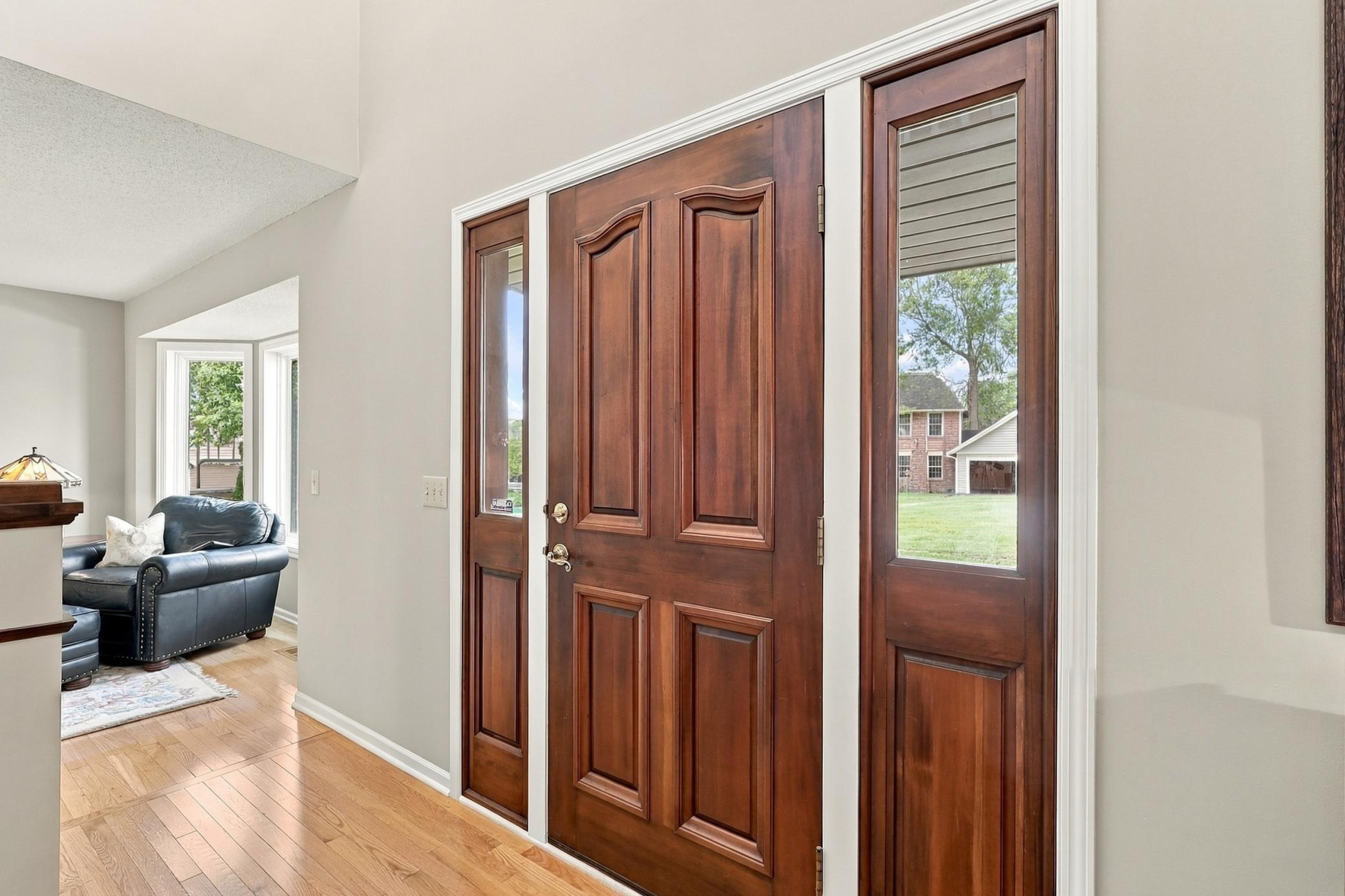 Welcoming front entry with custom detailing.