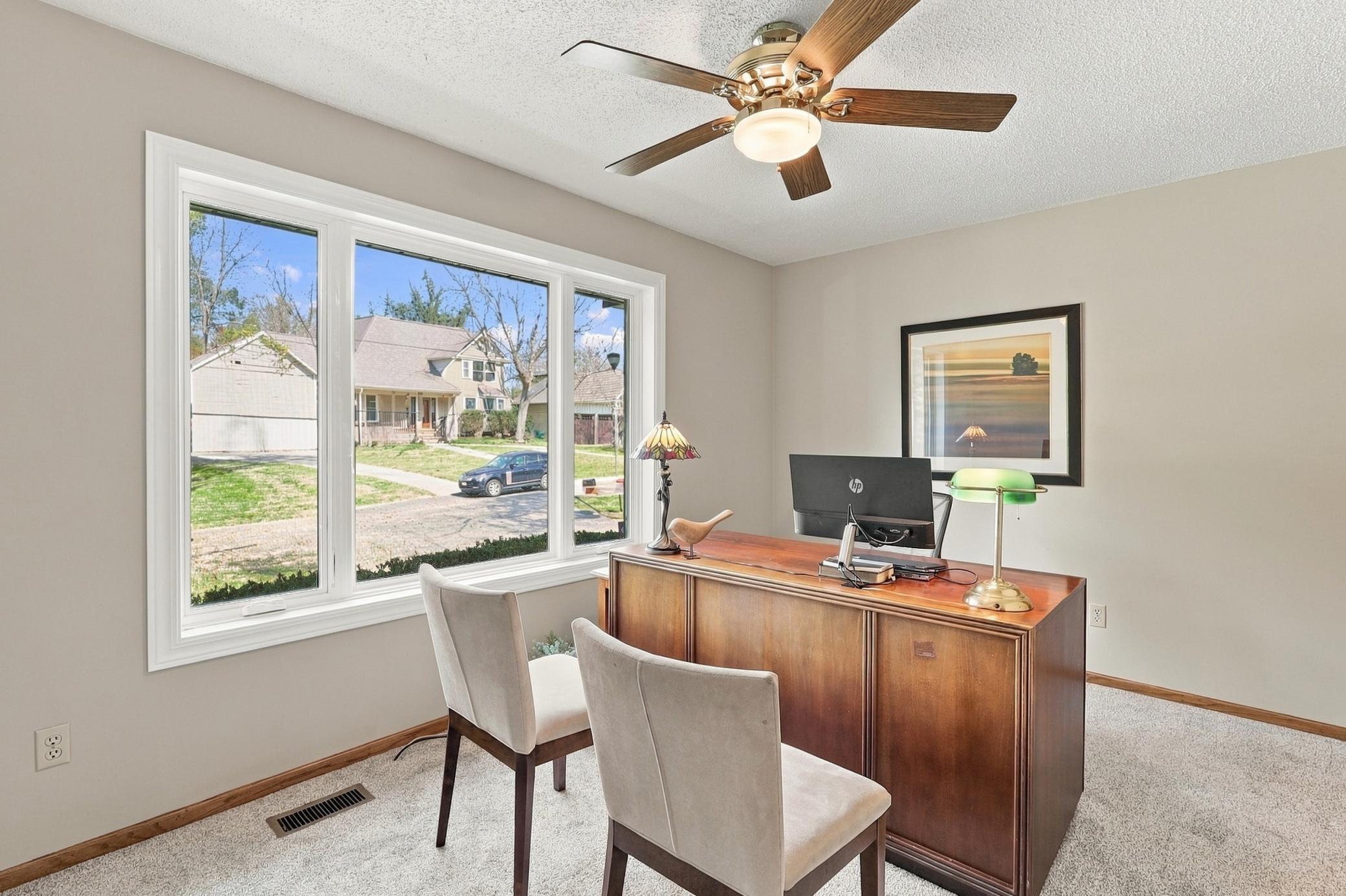 Main-floor bedroom offers flexibility for guests or a home office.