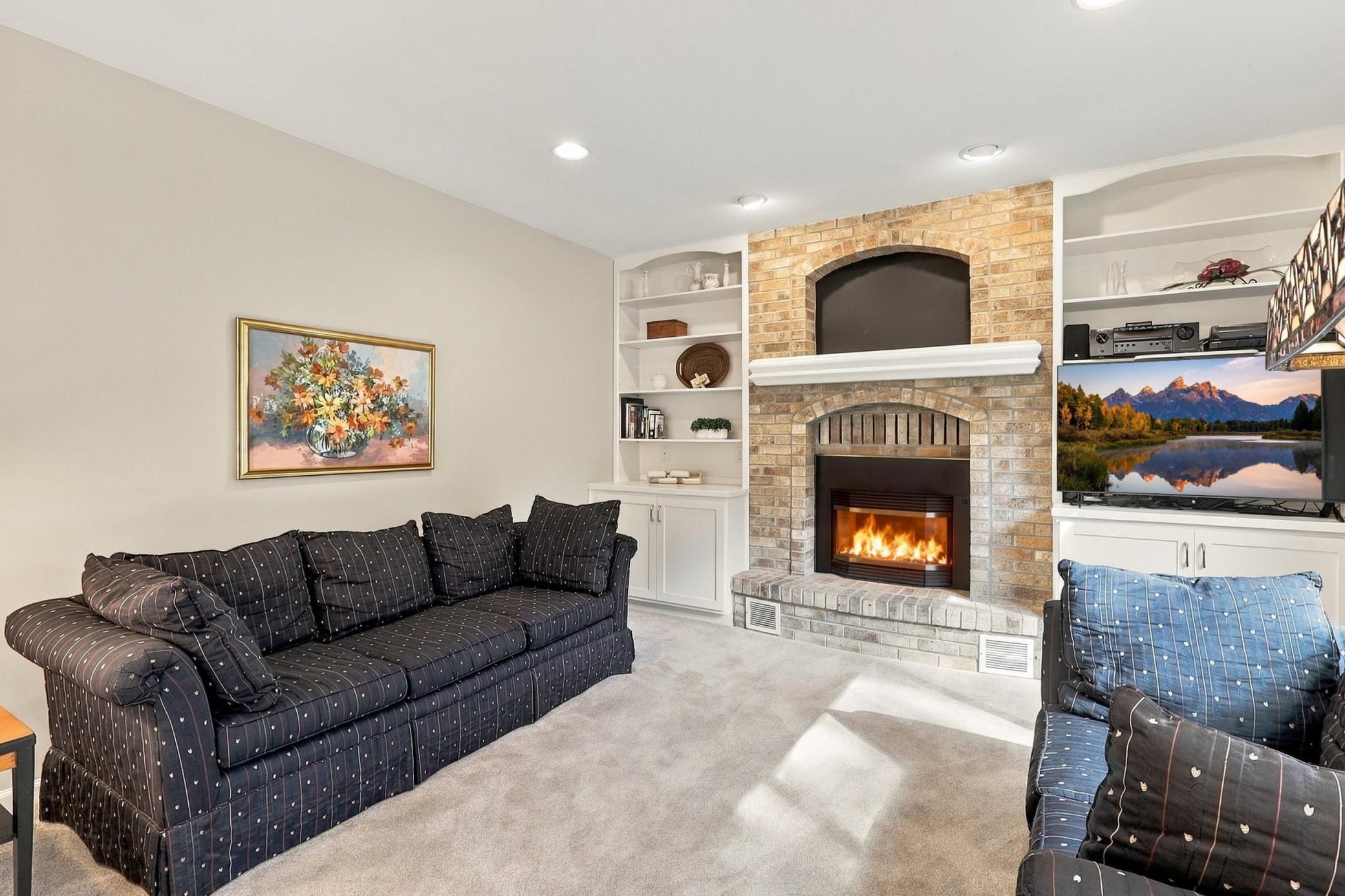 Gas fireplace creates a warm and welcoming focal point.
