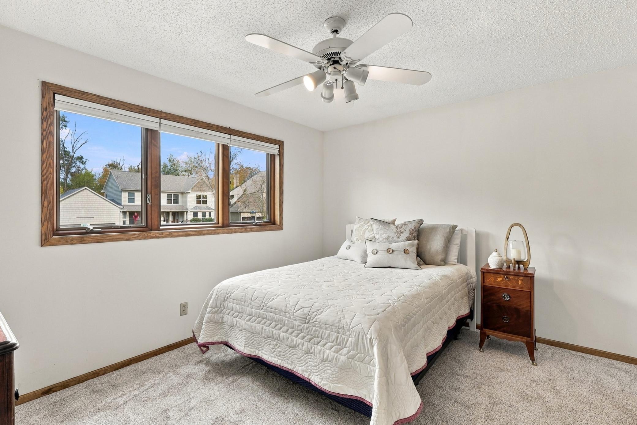 Spacious bedroom with fresh paint and new carpet.