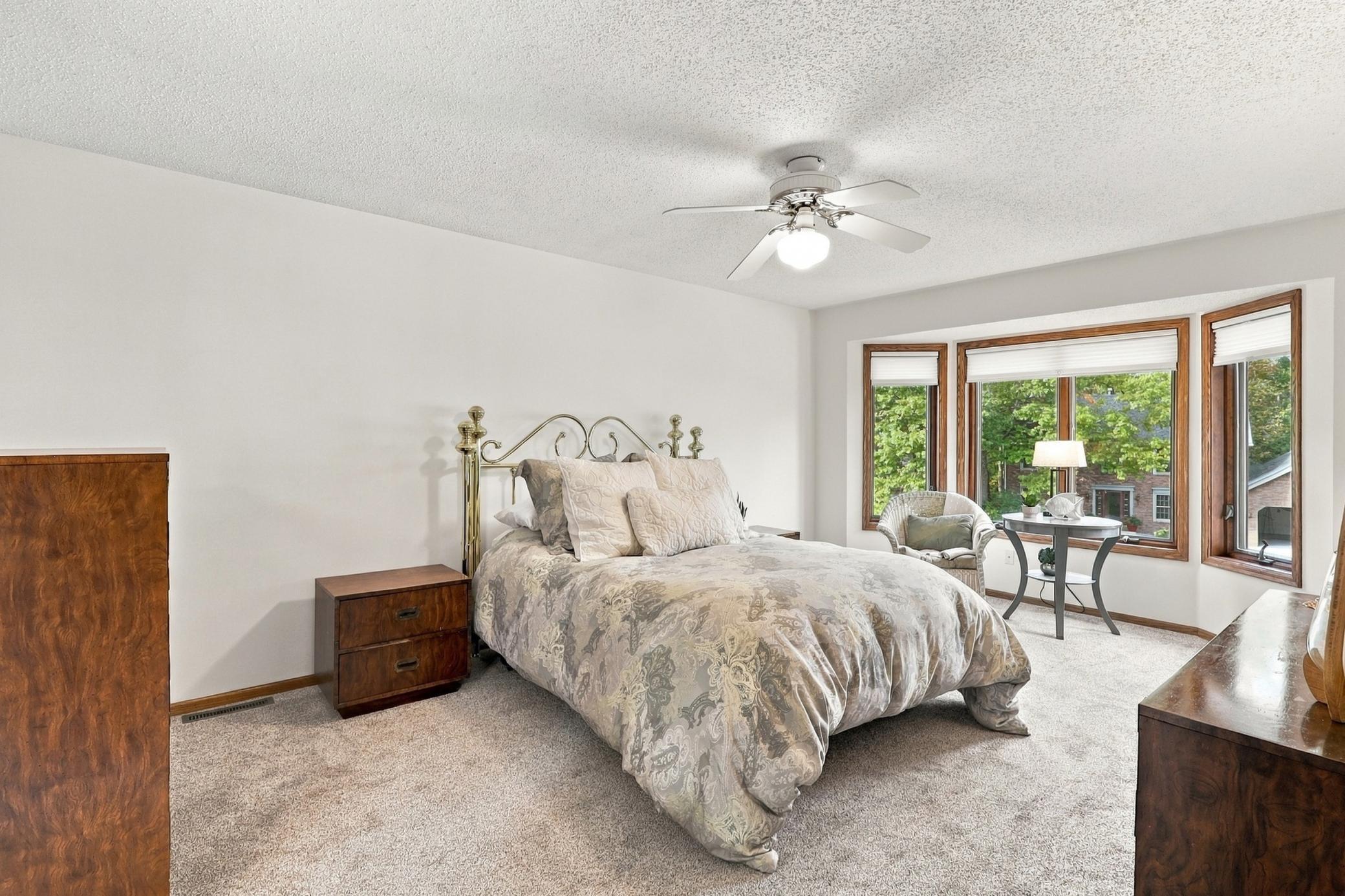 Primary suite features comfortable space and timeless appeal.