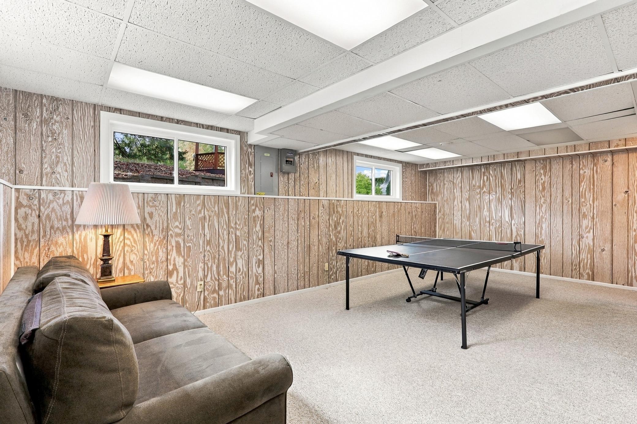 Versatile recreation room perfect for movie nights, games, and gatherings.