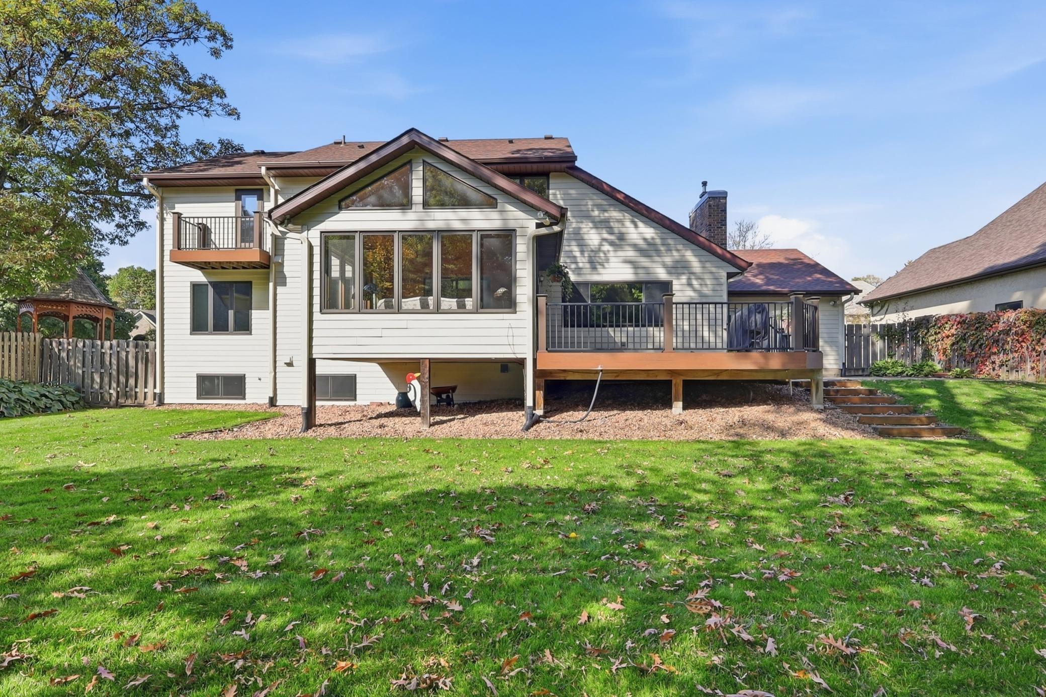 Multiple outdoor living spaces offer plenty of opportunities to relax, entertain, and enjoy the surroundings.