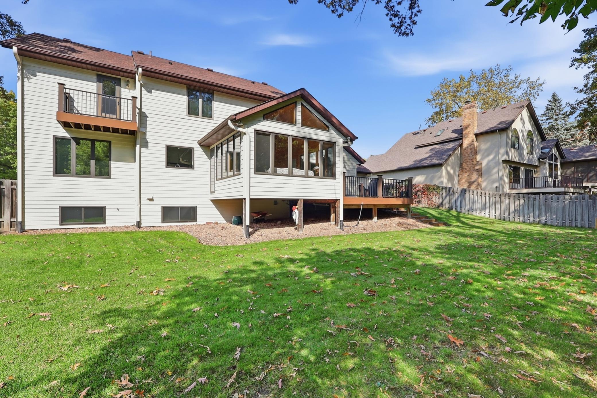 Enjoy fresh air and backyard views from this desirable Eagan property.