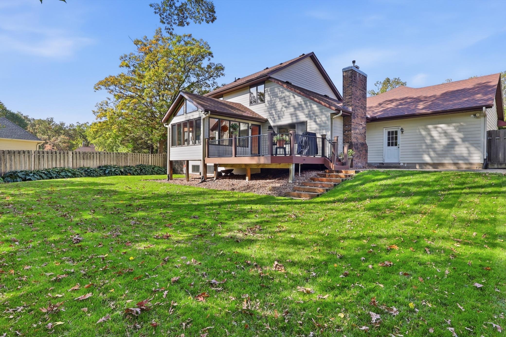 Enjoy the changing seasons from the comfort of the bright cedar sunroom.