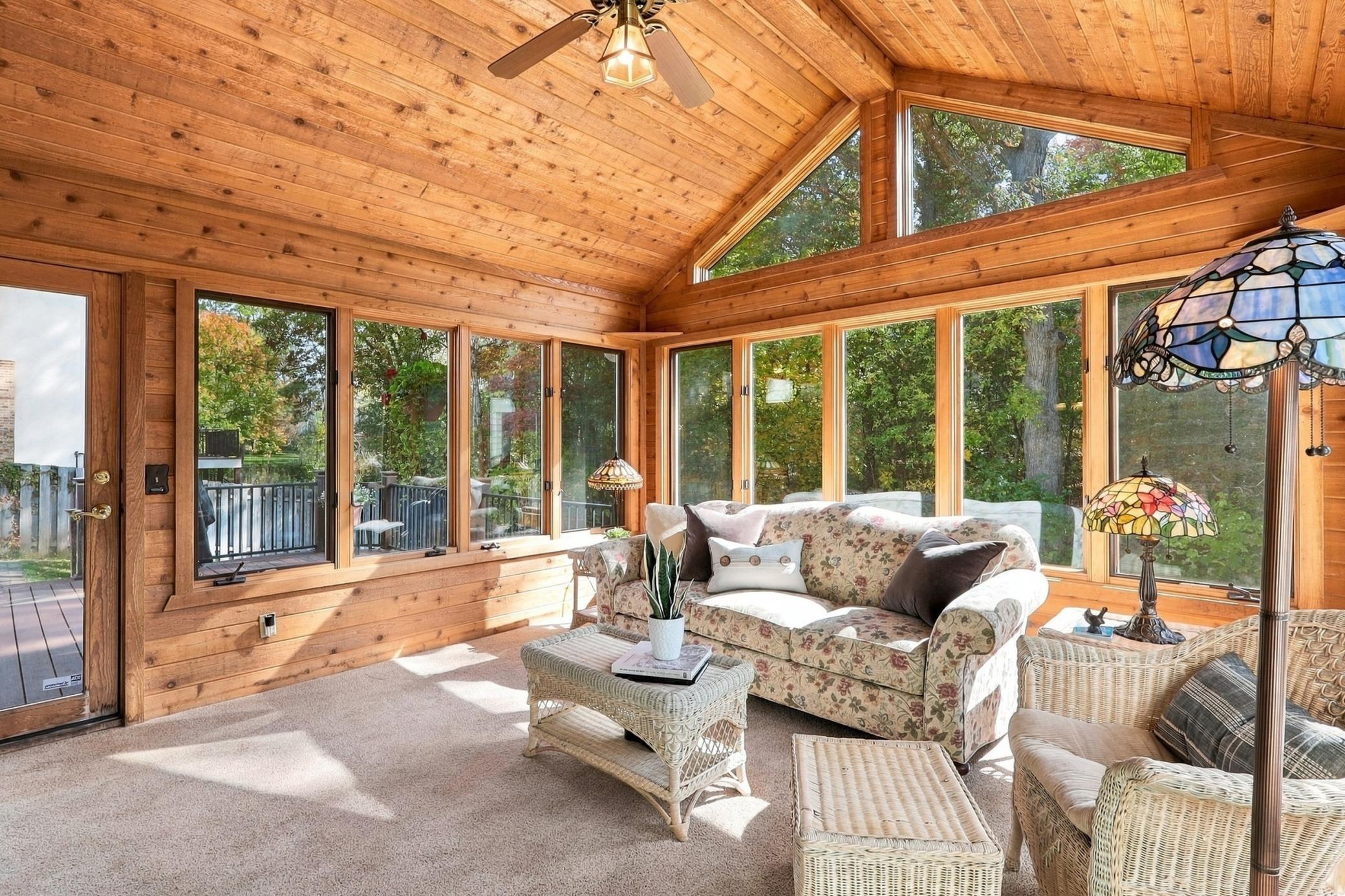 Sun-filled vaulted cedar sunroom offers a relaxing retreat.