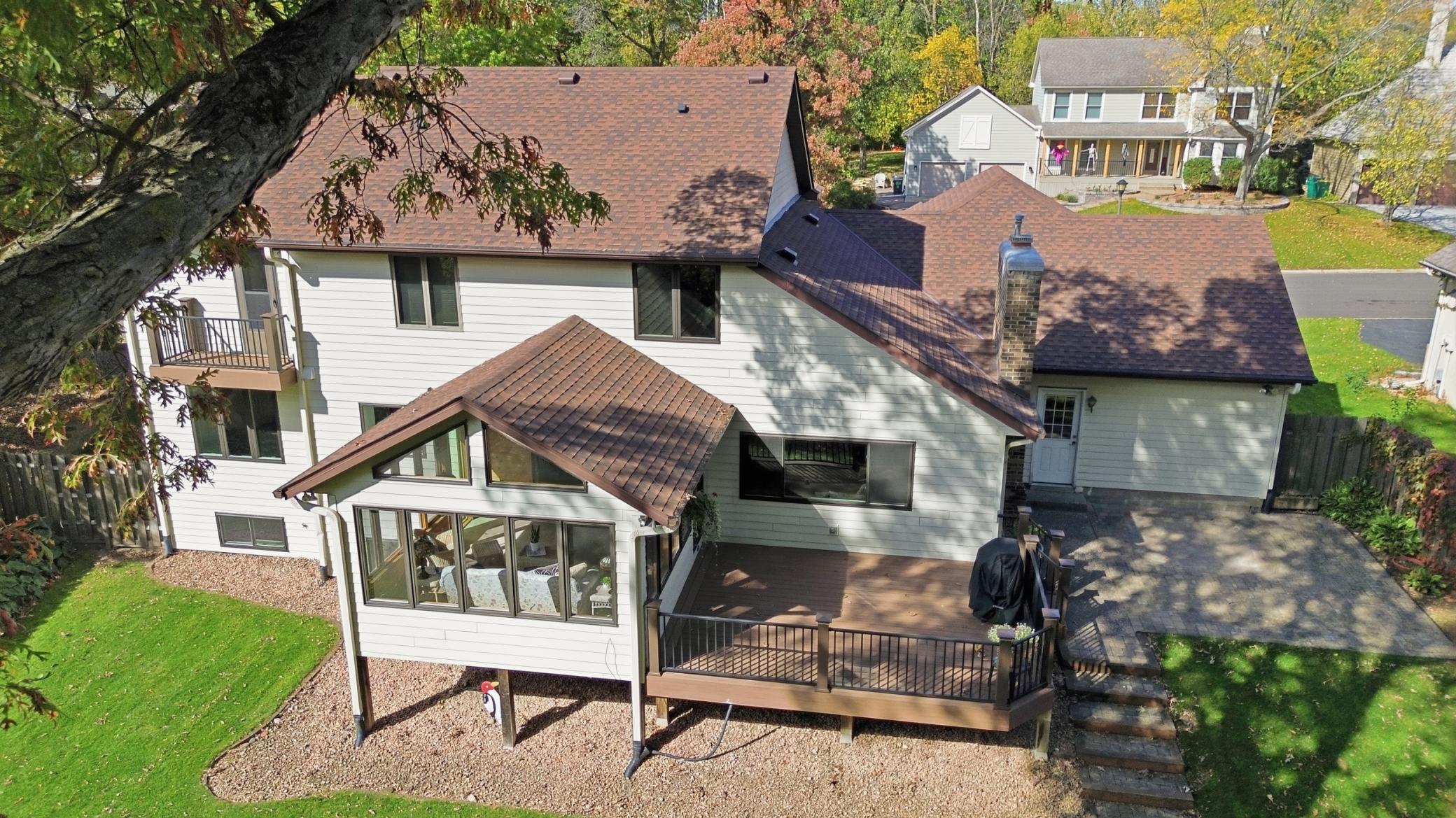 Enjoy indoor-outdoor living from the sunroom and deck.