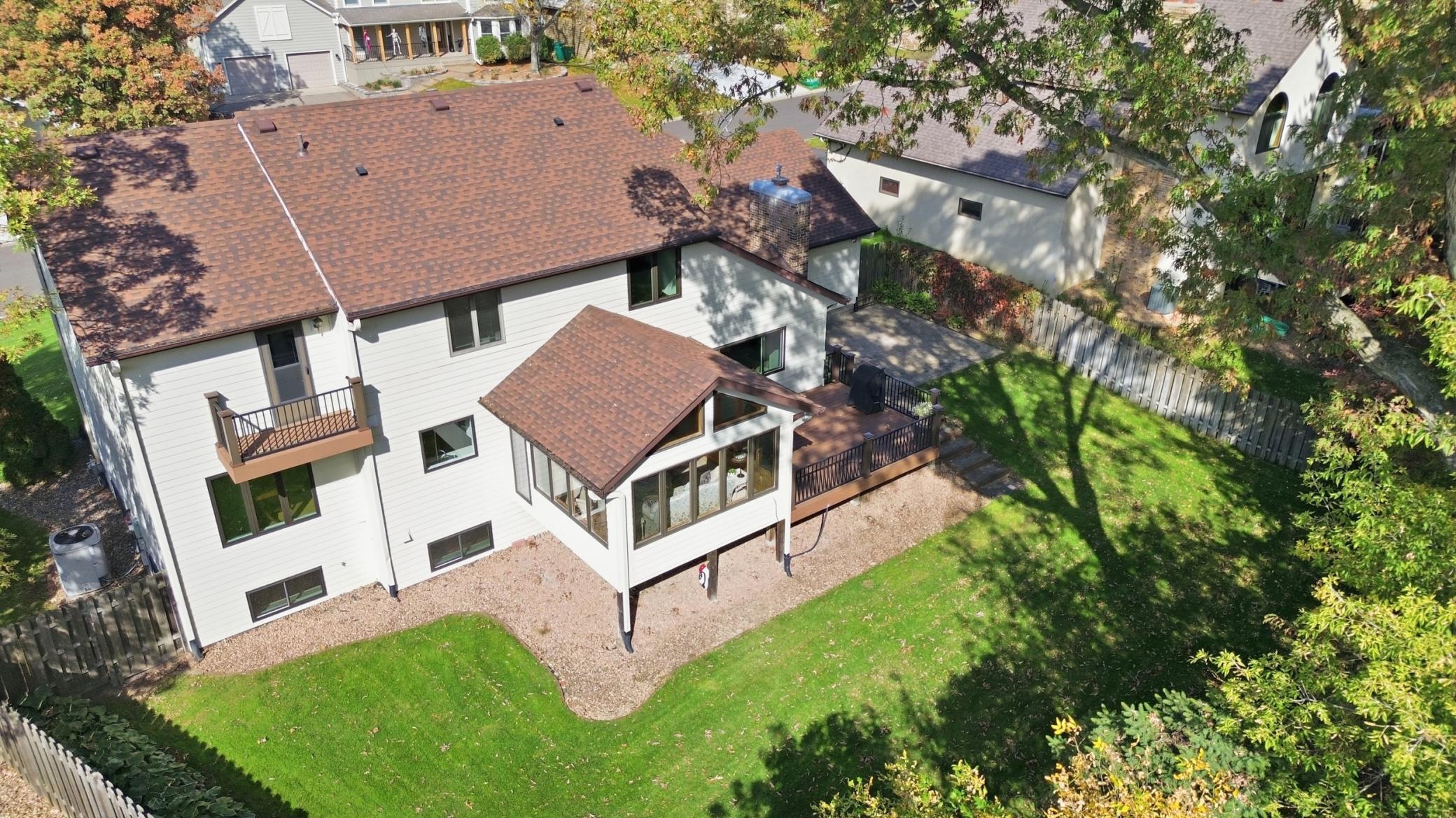 Private balcony off the primary suite offers peaceful views overlooking the backyard.