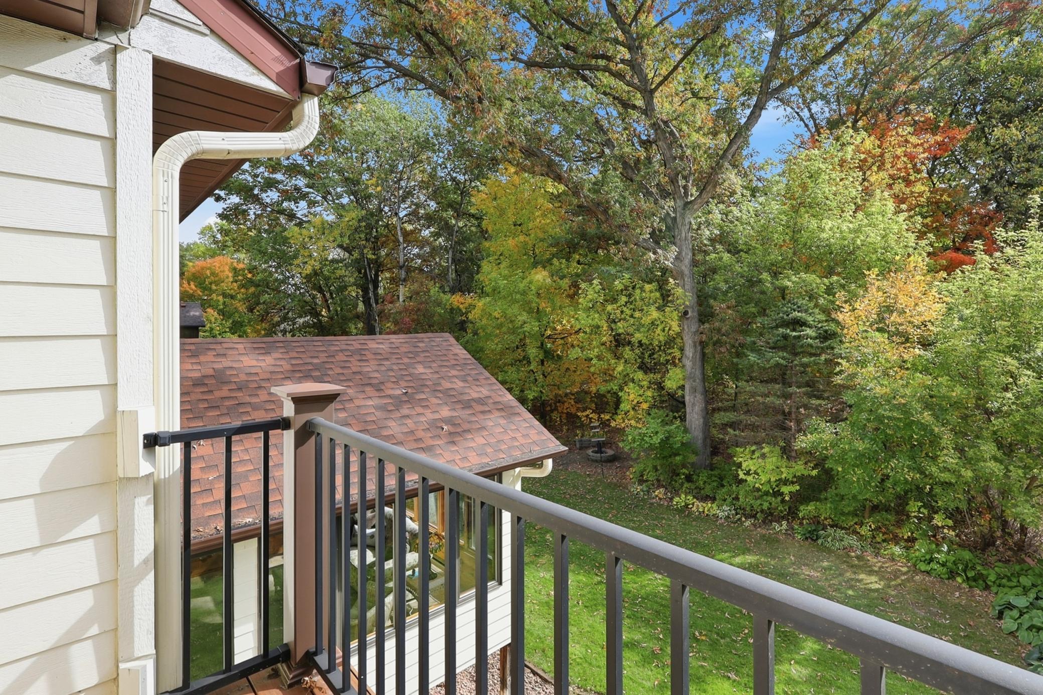 A special retreat off the primary suite, featuring elevated views of the backyard and surrounding landscape.
