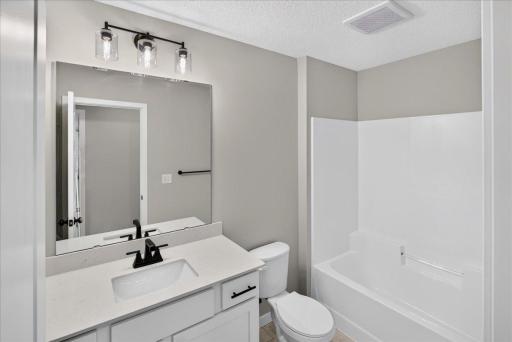 PHOTO OF A DIFFERENT HOME WITH SIMILAR PLAN & FINISHES. Plan and finishes may vary. Upper Floor Main Full Bathroom.