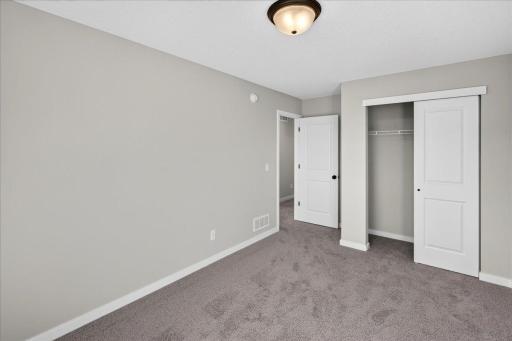 PHOTO OF A DIFFERENT HOME WITH SIMILAR PLAN & FINISHES. Plan and finishes may vary. Bedroom 3.