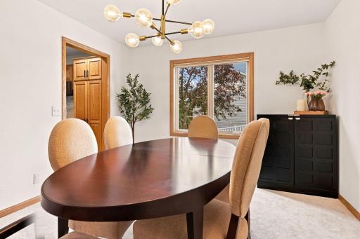 Formal dining room with fresh paint and new carpet.