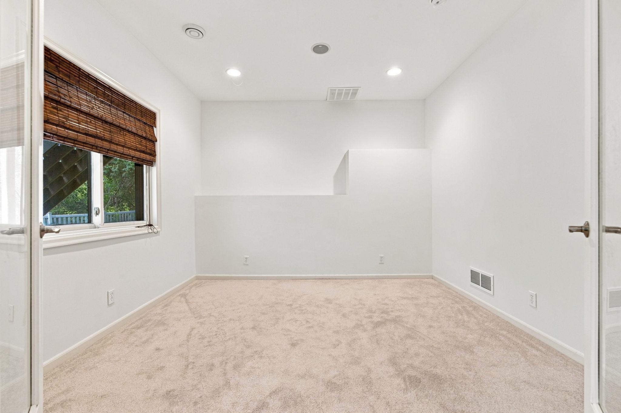 Lower-level bedroom offers a private and comfortable space.