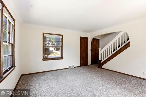 Spacious living room area, with new carpet and fresh paint