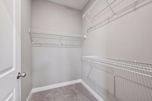 Large primary bedroom with ensuite bathroom and walk in closet