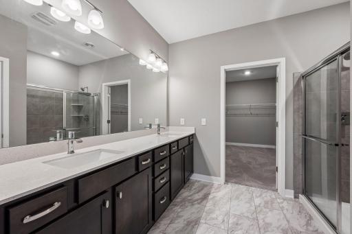 Large primary bedroom with ensuite bathroom and walk in closet