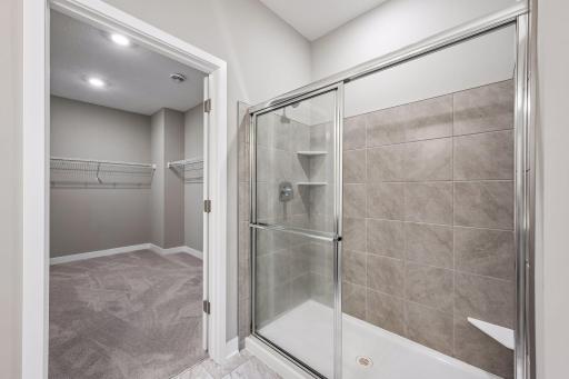 Large primary bedroom with ensuite bathroom and walk in closet