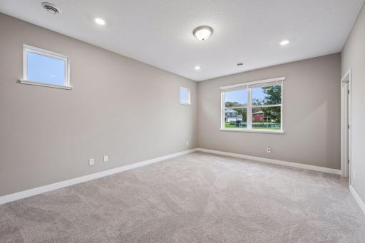Large primary bedroom with ensuite bathroom and walk in closet