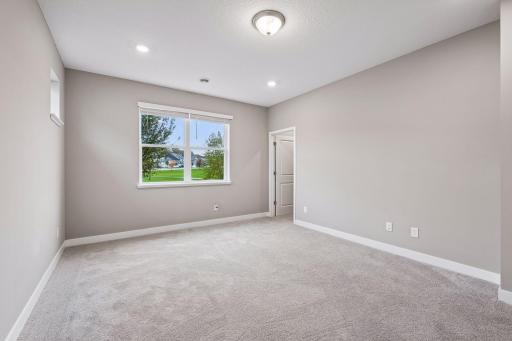 Large primary bedroom with ensuite bathroom and walk in closet