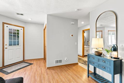 Welcoming entry way with coat closet for extra storage.