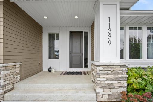 Welcome your guests with a stamped concrete and covered entryway