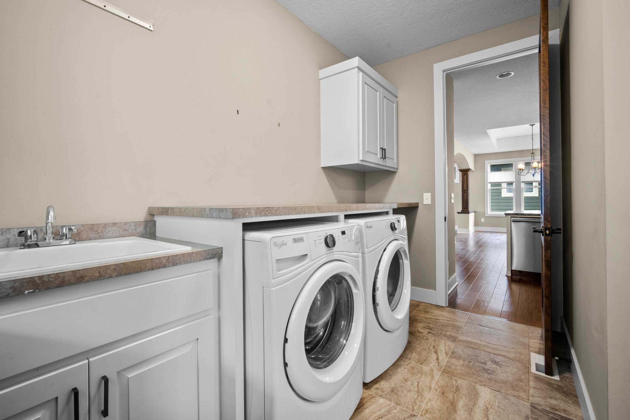 Laundry room lots of counter top space and pocket doors for easy access from living area to the primary bedroom.