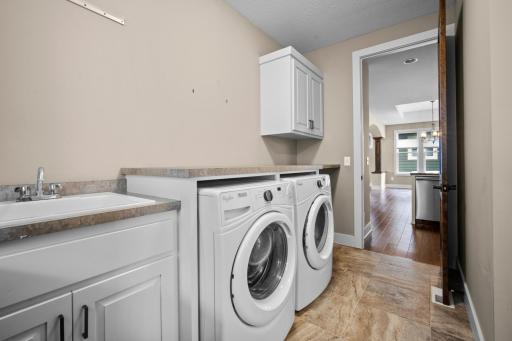 Laundry room lots of counter top space and pocket doors for easy access from living area to the primary bedroom.