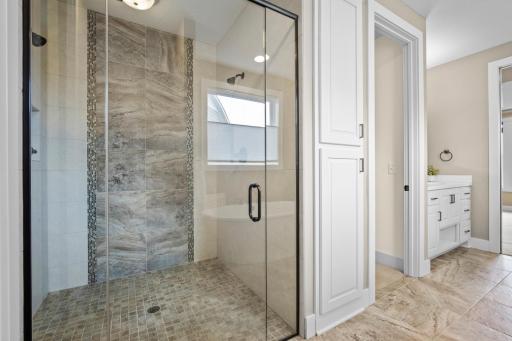 Dual headed walk in shower has stunning tile work