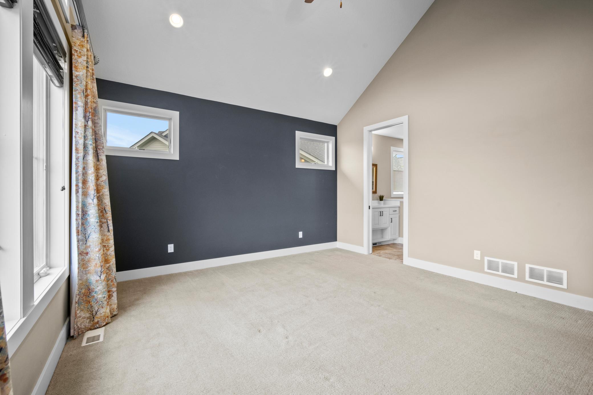 Primary bathroom with dual sinks is on the right