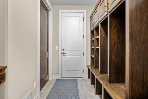 Mudroom has built in lockers with tons of extra storage. Also features a walk in closet.