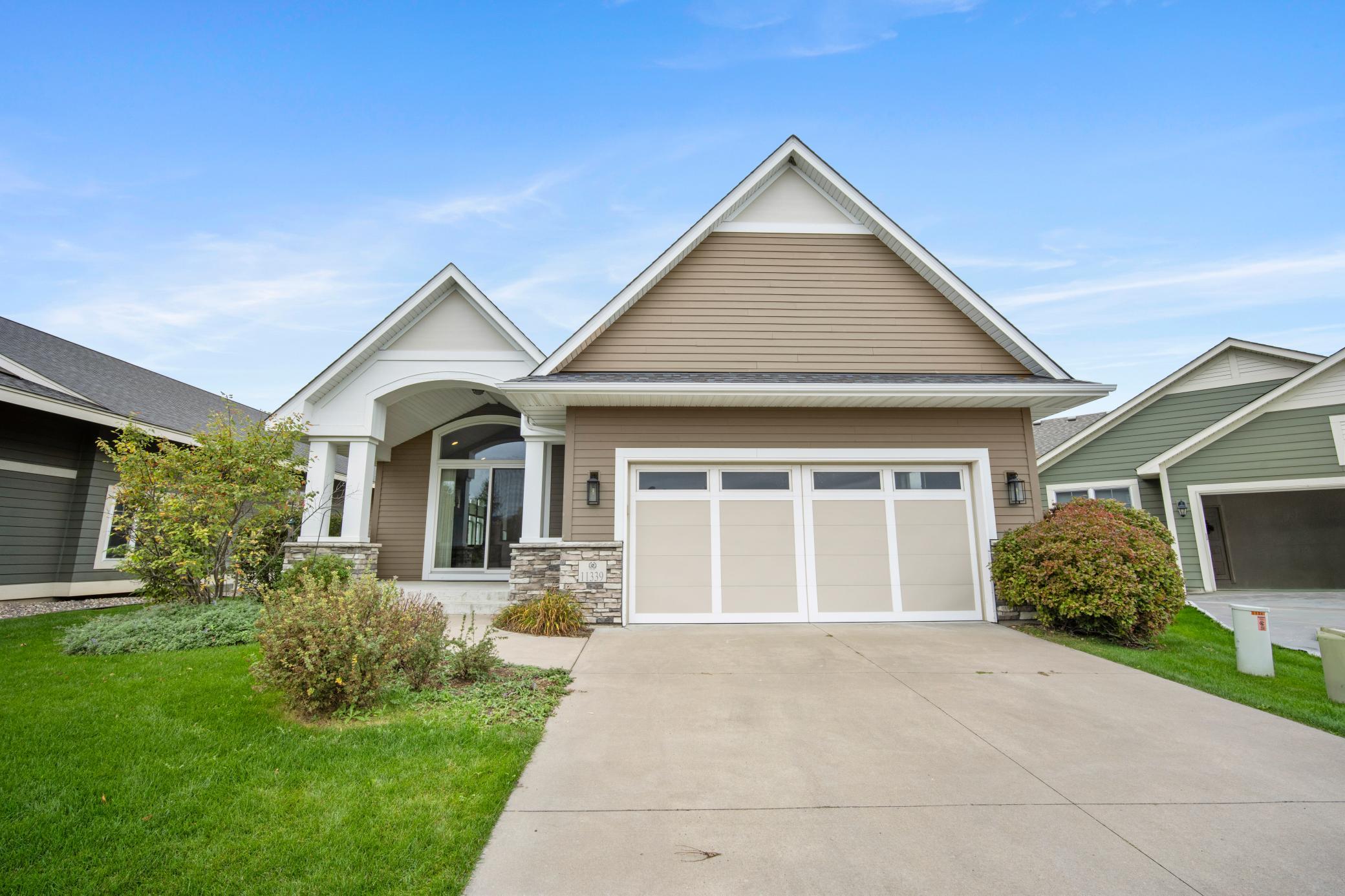 Large concrete driveway to welcome you home. Lots of space with a3 car tandem garage