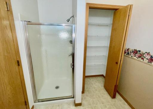 Second bath with shower stall and linen closet