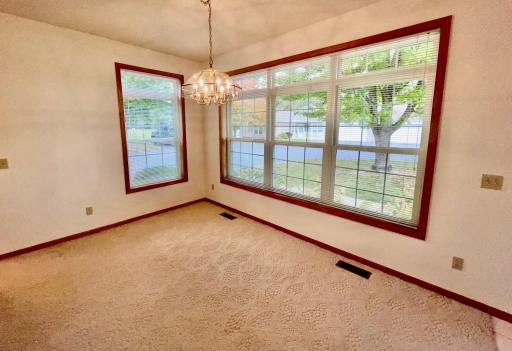 Formal dining area with plenty of windows for entertaining