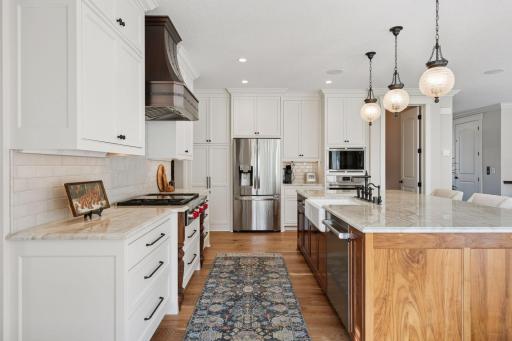 High-end stainless appliances (Wolf gas cooktop & wall oven).