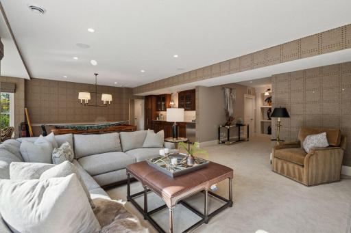Lower level family room. Top-tier finishes throughout this exceptional home.