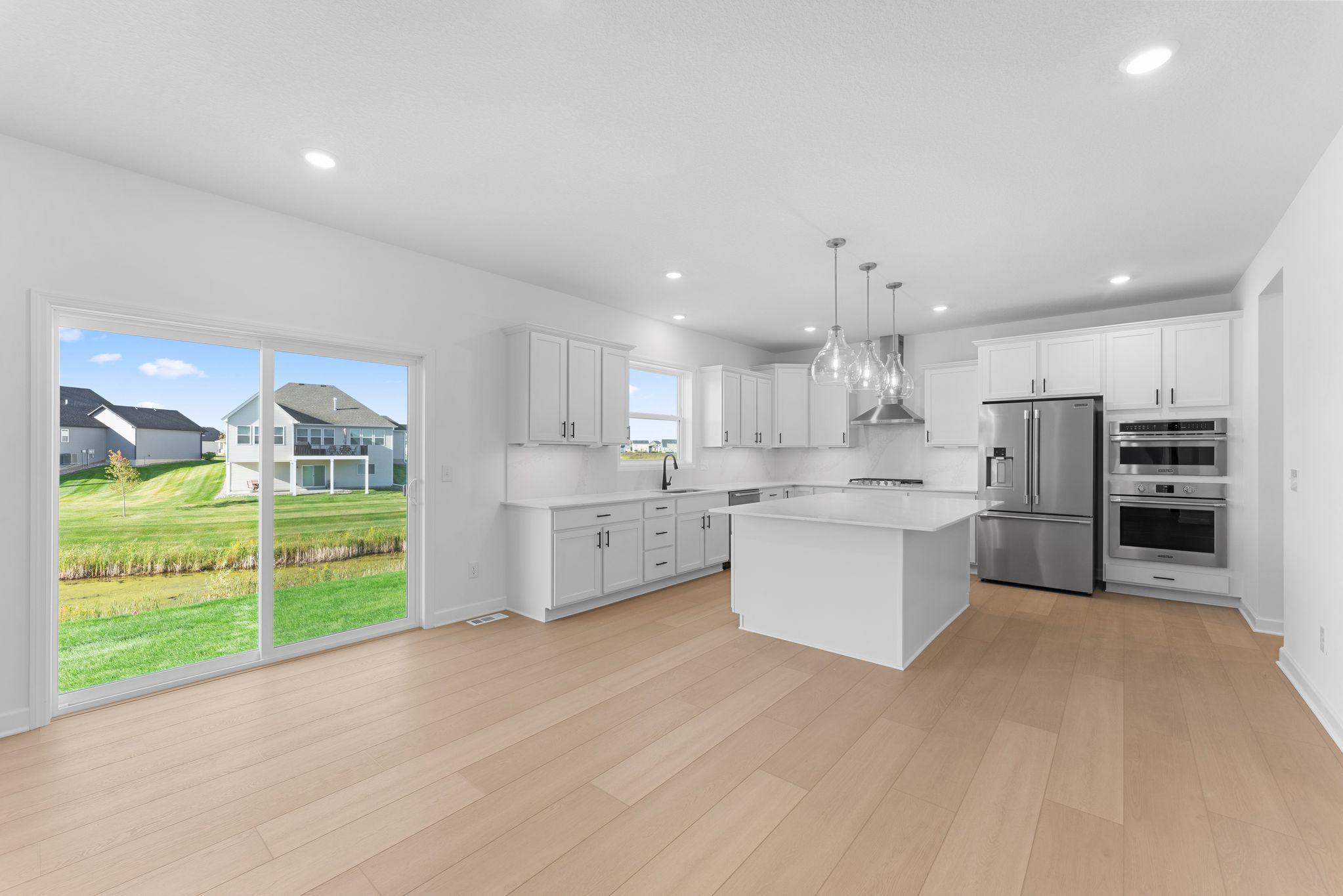 (All the following photos are of a similar home, actual finishes may vary.) The kitchen is equally stylish and practical with sleek cabinetry, high-end finishes and all-new stainless steel appliances.