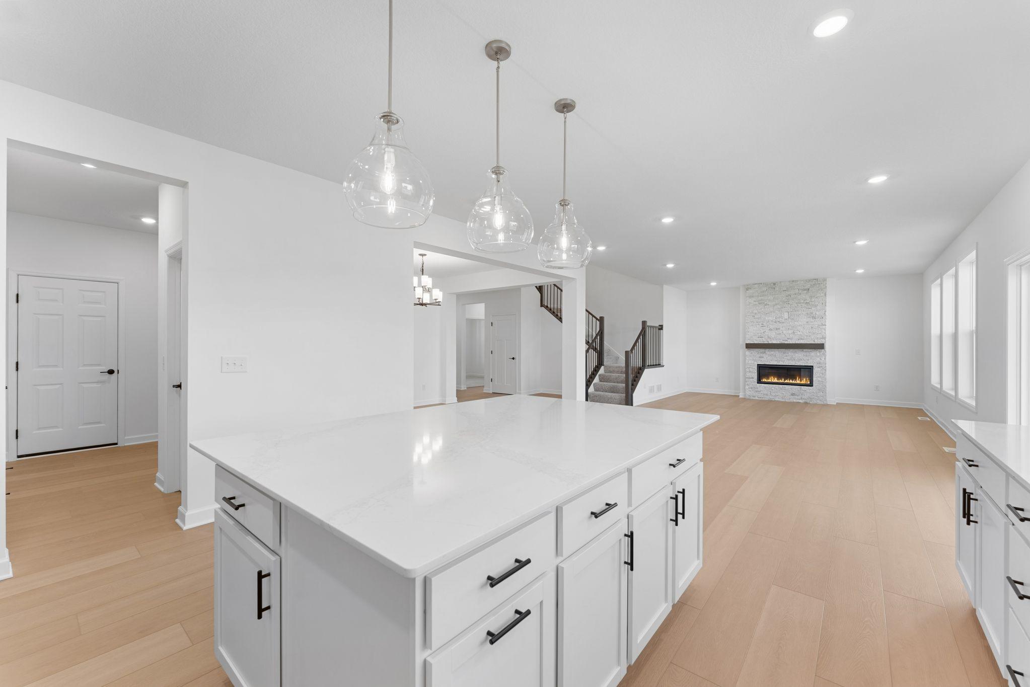 The center island is versatile and ready for preparing home-cooked meals or hosting multiple guests at the breakfast bar