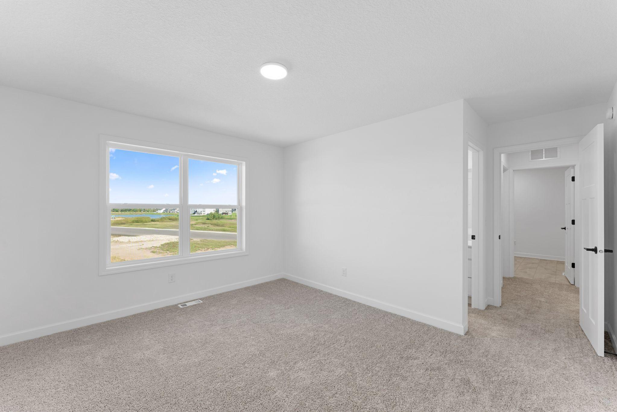 Three secondary bedrooms are situated down the hall from the owner’s suite on the second floor.
