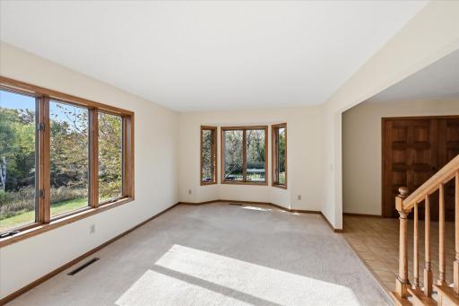 Main floor living room looking south from office/den space