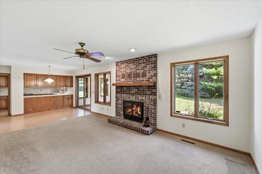 Main floor family room open to eat in kitchen and 4 season porch