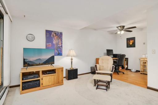 Spacious dining/flex area adjacent to the kitchen offers room for dining, a home office, or additional living space.