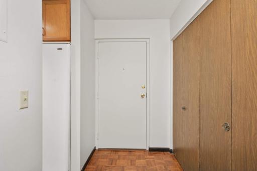 Step inside to a welcoming entry with a spacious coat closet, providing practical storage right at the front door.