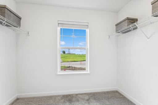 (Photo of a model home, actual homes finishes will vary) Huge Owner's suite closet!