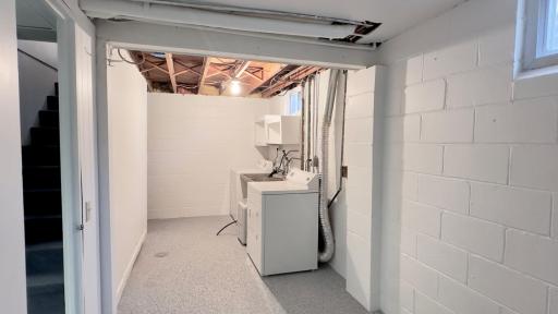 Even the laundry room has been recently painted and epoxy floors added to make it feel clean and bright